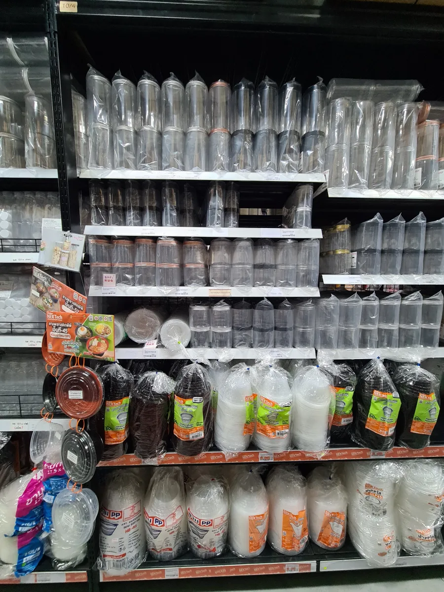 Clear jars with lids alongside plastic bowls and cups